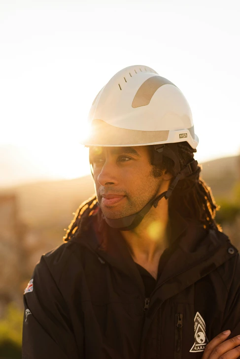 Man in helmet with dreads