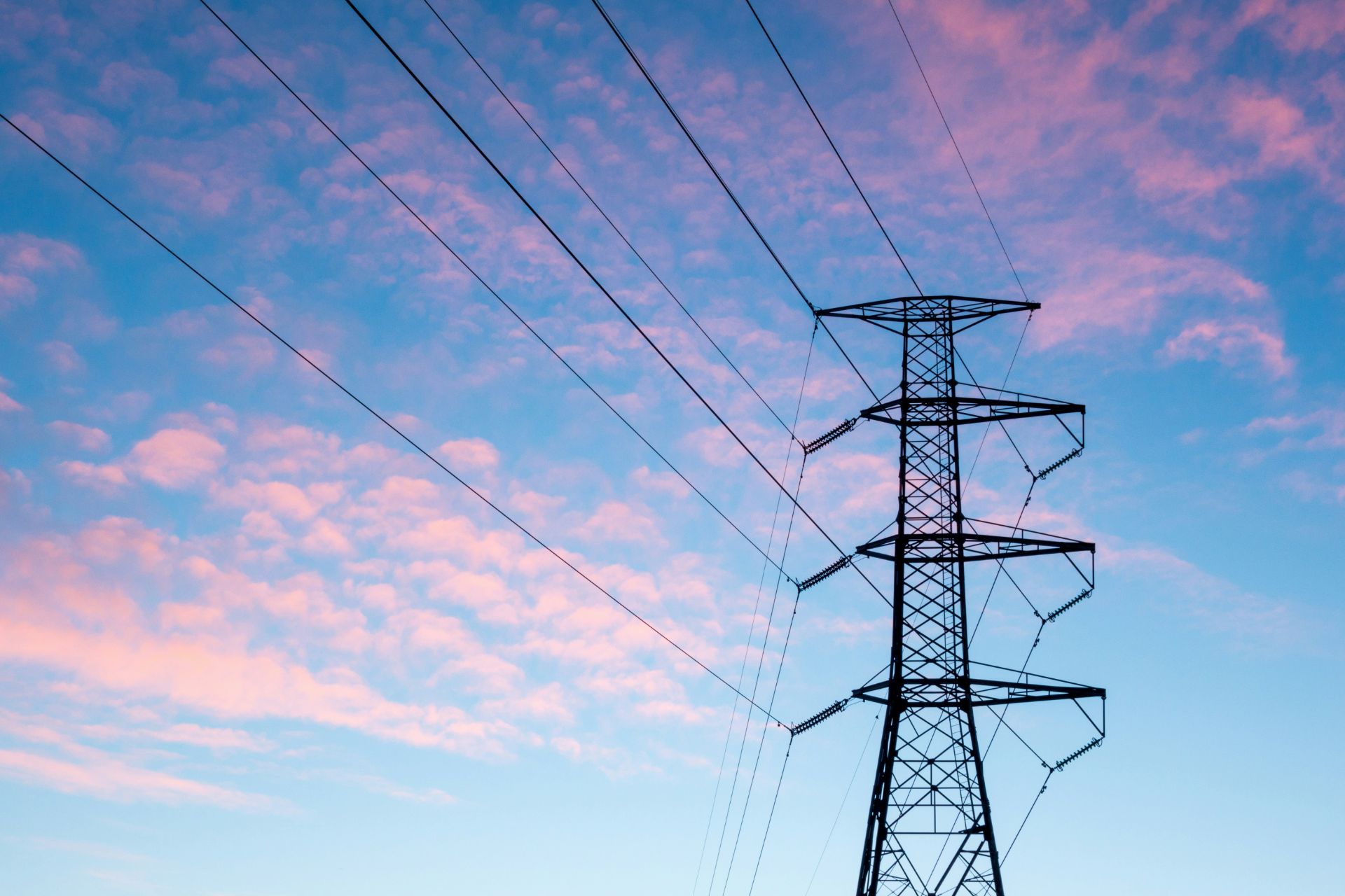 electrical tower in blue pink sky