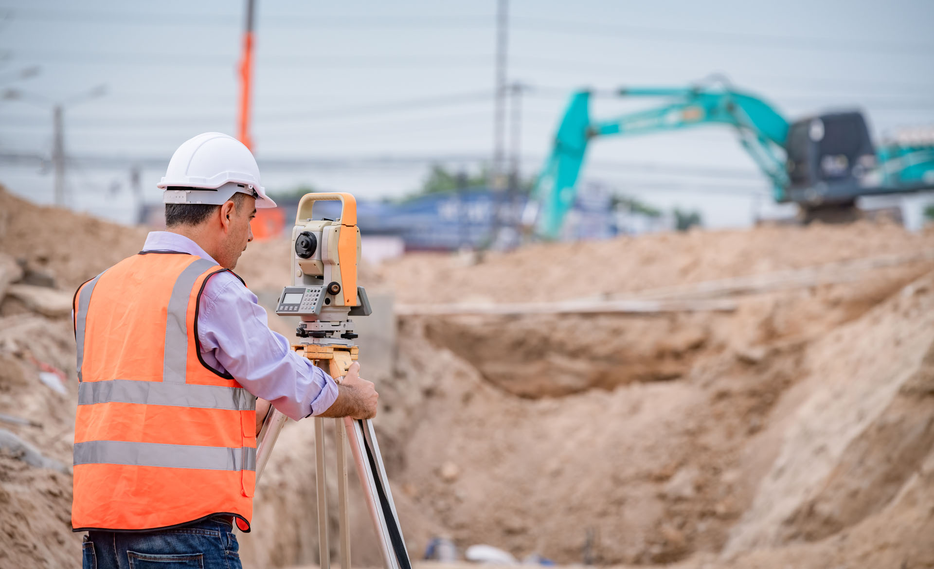 construction worker-using measuring instrument